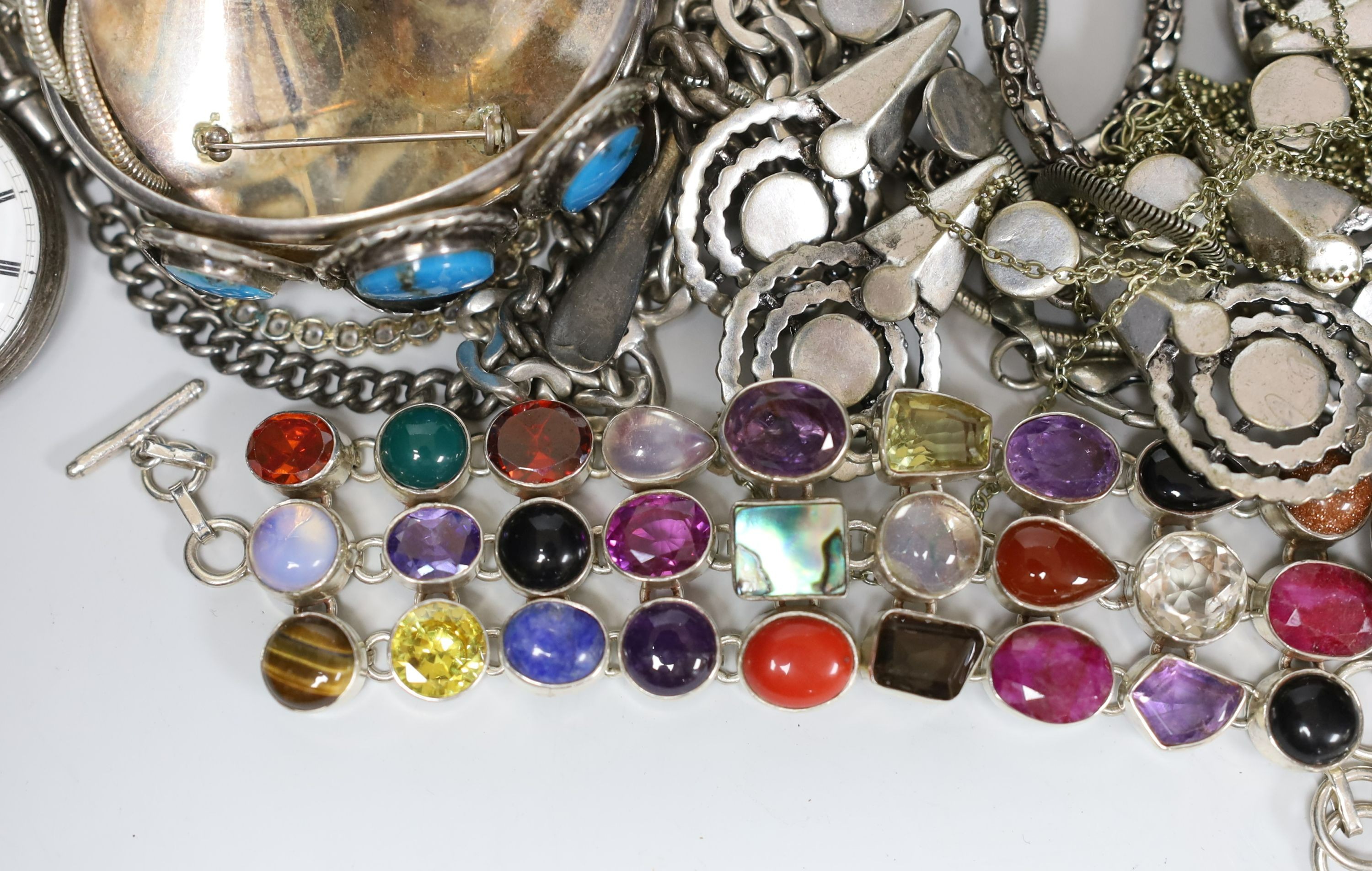 A quantity of assorted silver and white metal jewellery etc. including albert chain with pocket watch, bangles, bracelets, brooches, money clip and rings.